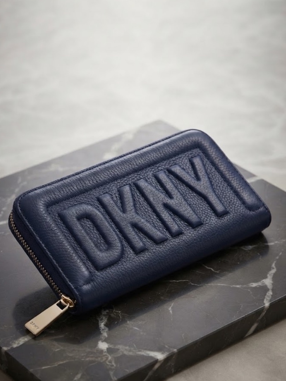 DKNY Embossed Logo Pebble Leather Zip Wallet in Deep Blue